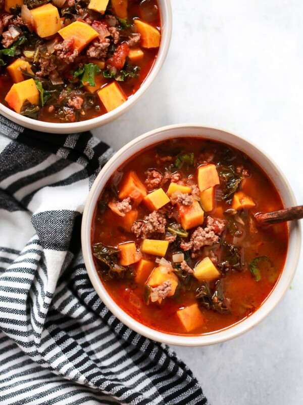overhead view of two bowls containing Ground Beef Butternut Squash Kale Soup