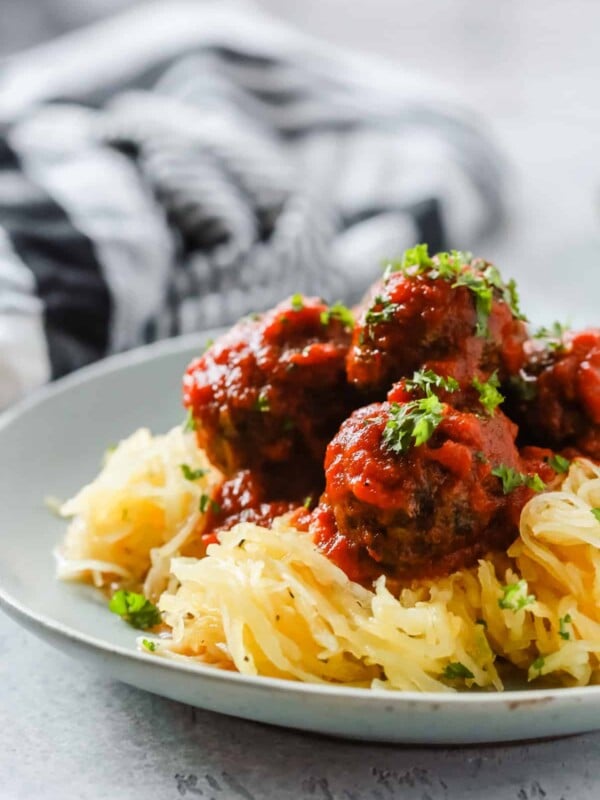 A close up of a plate containing Spaghetti Squash and Meatballs