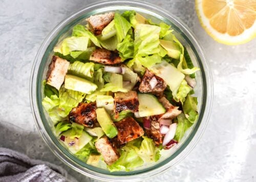 chopped chicken salad inside of a meal prep containers.