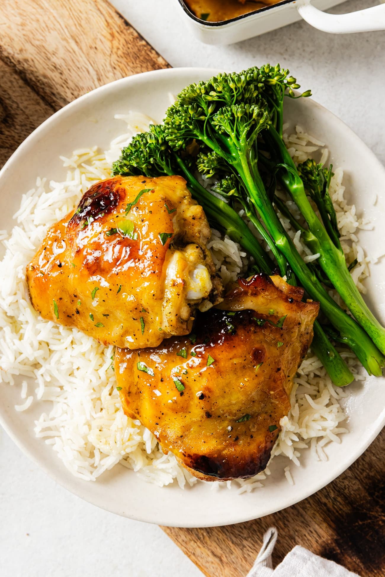 chicken thighs on a plate with rice
