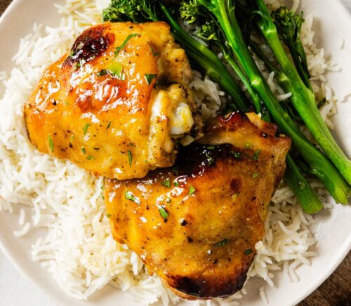 Dijon Chicken thighs with rice on a plate