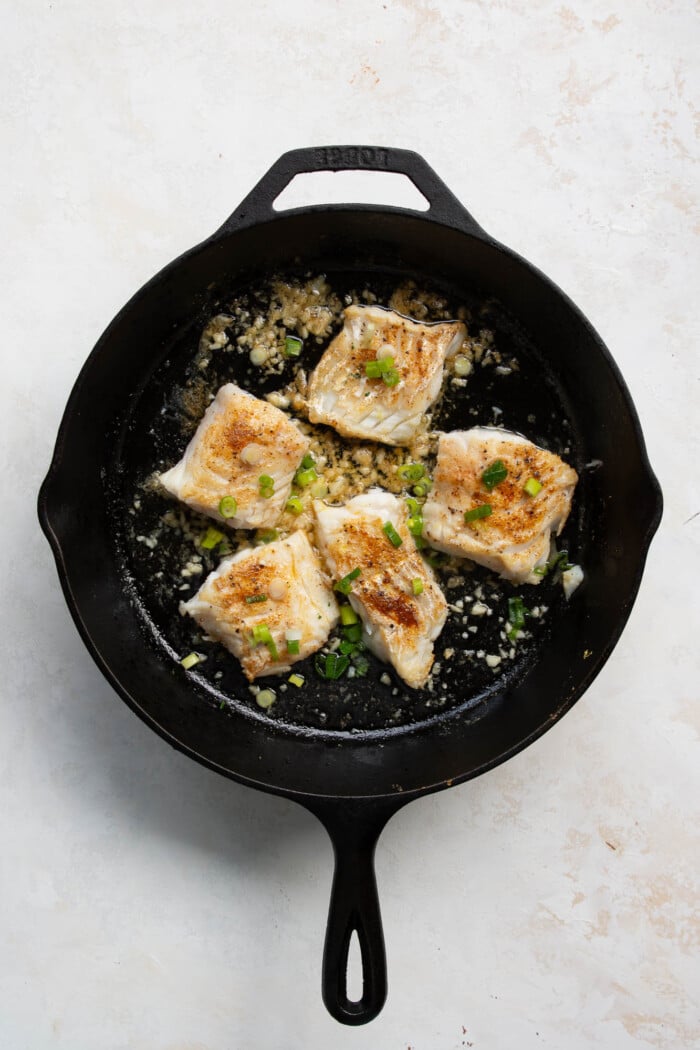 garlic butter cod in a skillet