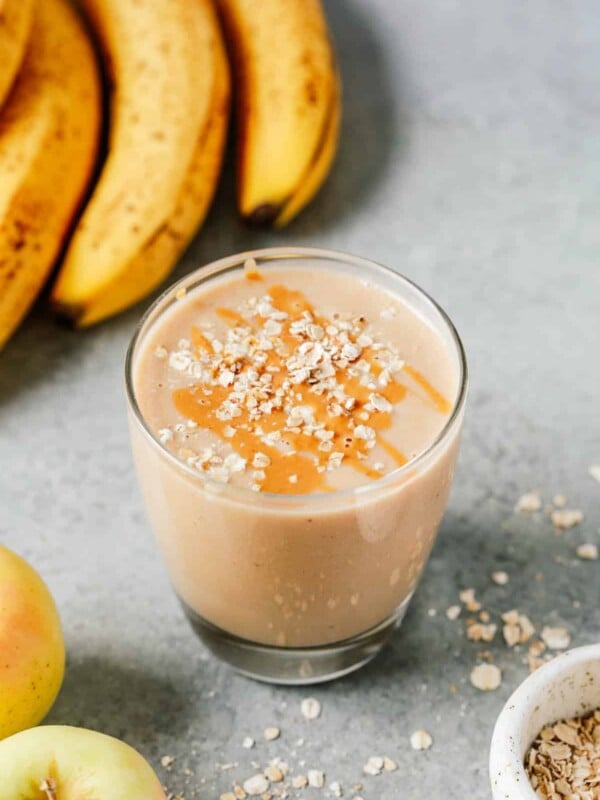 cup of apple smoothie with oats sprinkled on top