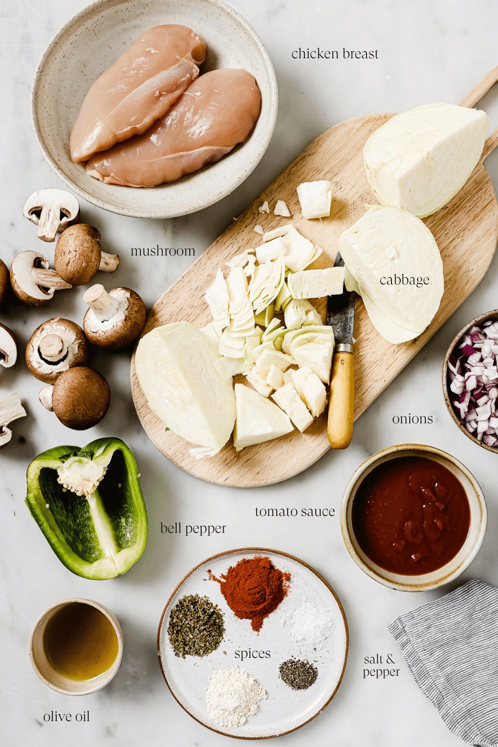 ingredients on a marble board to make chicken cabbage recipe