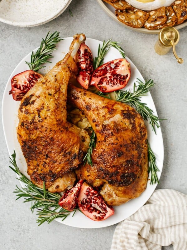 overhead view of roasted turkey leg on a white plate