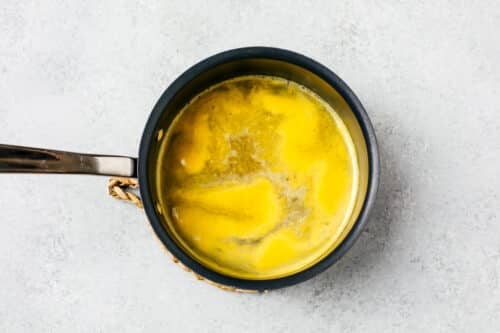 overhead view of orange juice in a pan