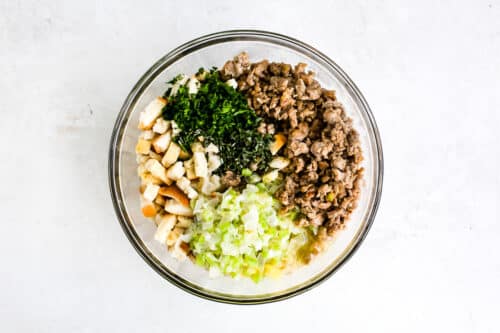 Easy Sausage Stuffing ingredients in a glass bowl