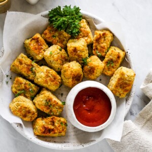 overhead view of cauliflower tots on a white plate