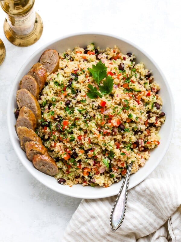 Quinoa salad in a large, white serving bowl.
