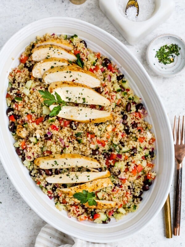 Chicken quinoa salad in a large, white serving dish.