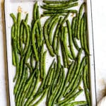 Roasted green beans on a baking sheet.
