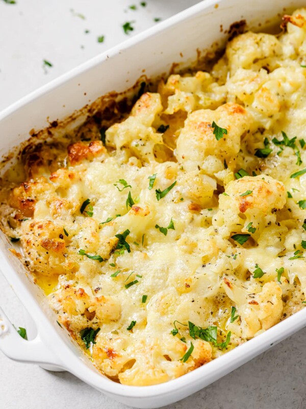 Close up of cauliflower au gratin in a baking dish.