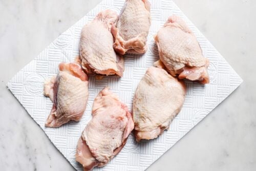 raw chicken thighs on a countertop