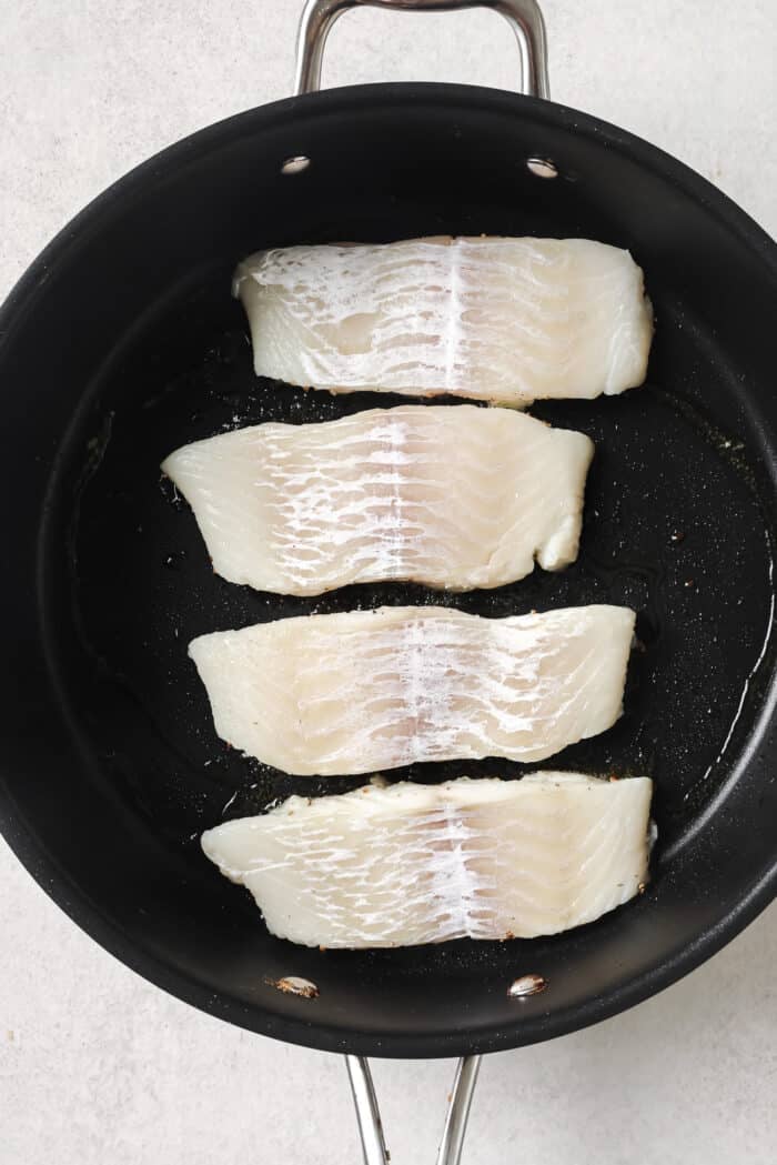 raw Haddock fillets in a skillet