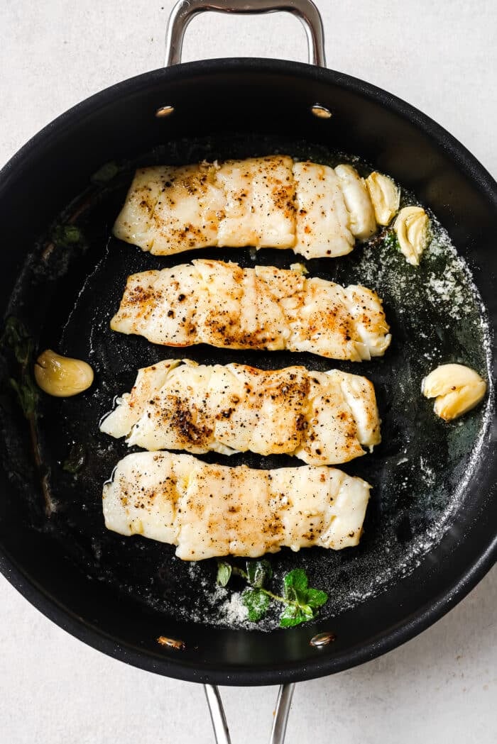 Garlic Butter Haddock in a skillet