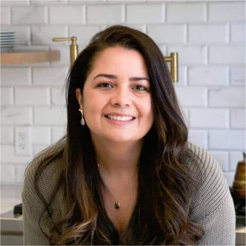A photo of Olivia (founder of Primavera Kitchen) in her kitchen.