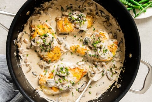 creamy mushroom chicken breast in a skillet