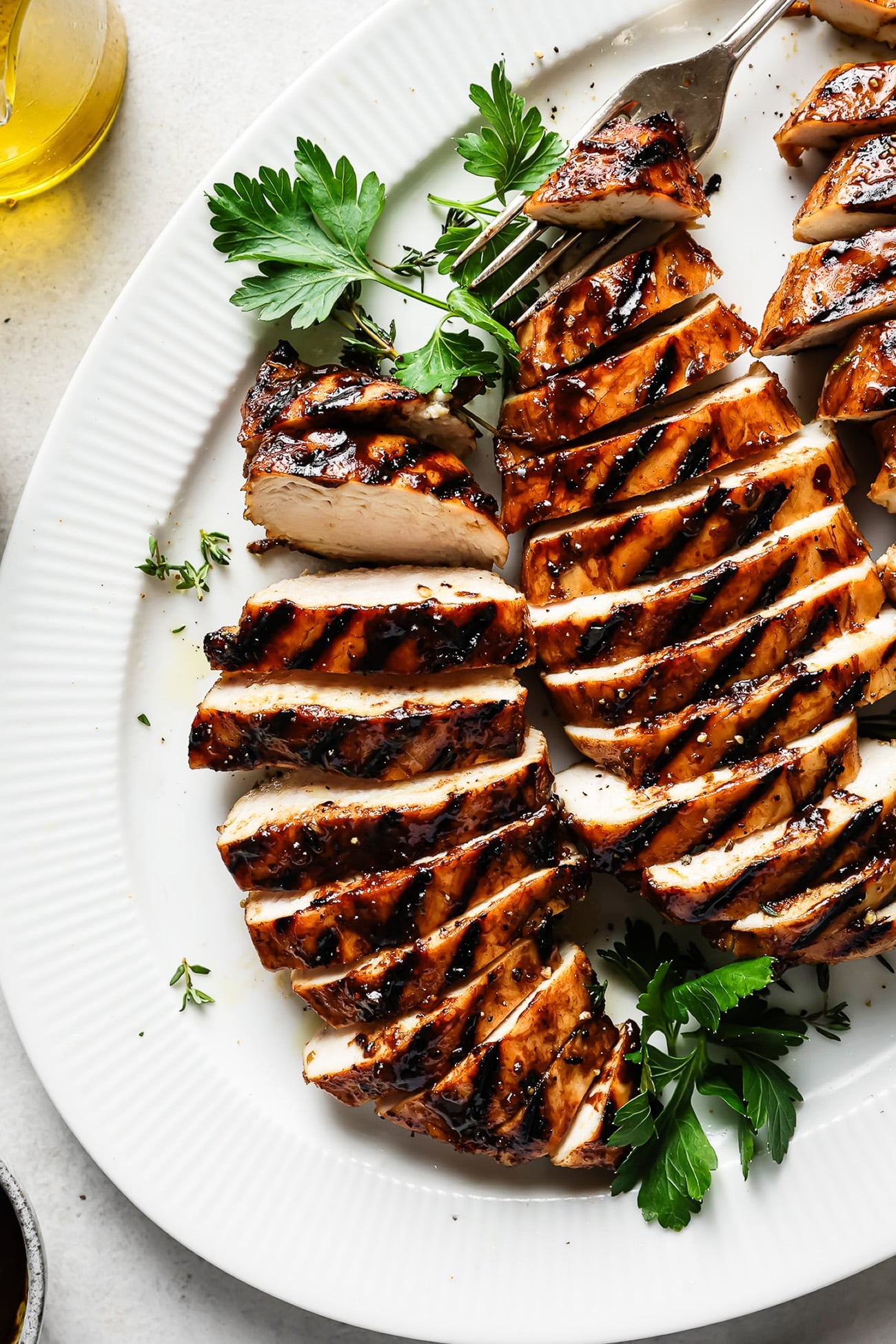 balsamic chicken on a white plate.
