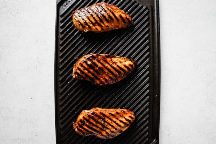 Chicken breast on a grill.