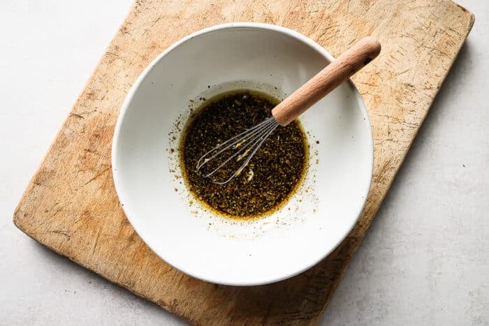 Balsamic marinade in a white bowl.