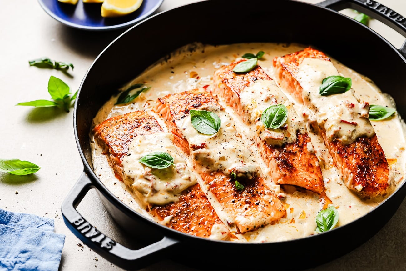 Overhead view of Marry Me Salmon in a cast-iron skillet.