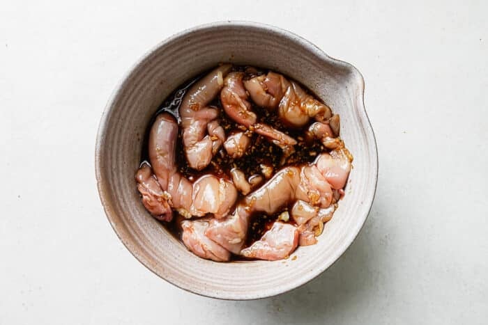 Chicken steeping in marinade.