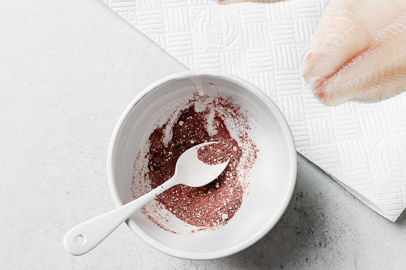 overhead view of spices in a white bowl.