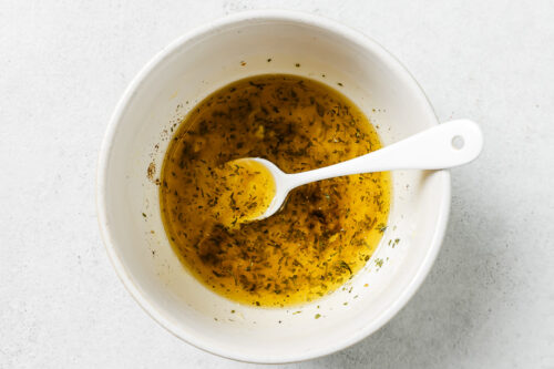 lemon butter sauce in a white bowl
