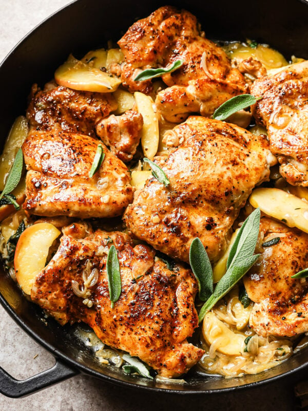 Apple cider chicken in a cast iron skillet.