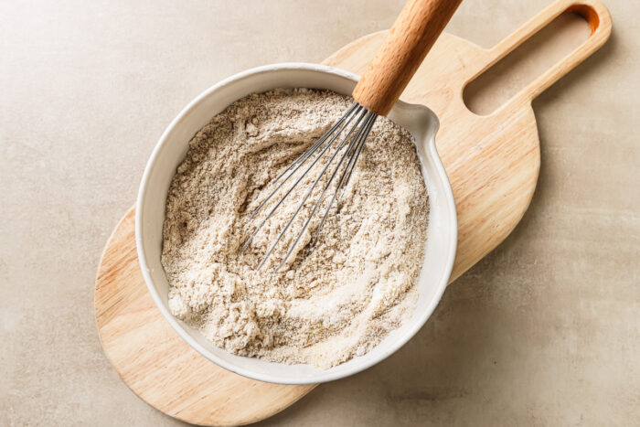 Dry baking ingredients inside a mixing bowl, ready to be combined.