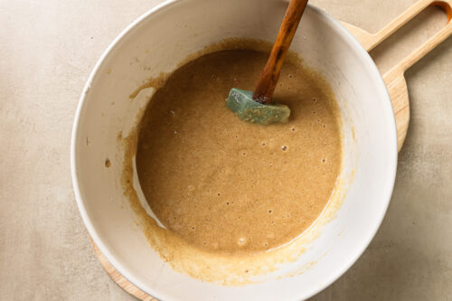 Wet and dry ingredients in a white bowl