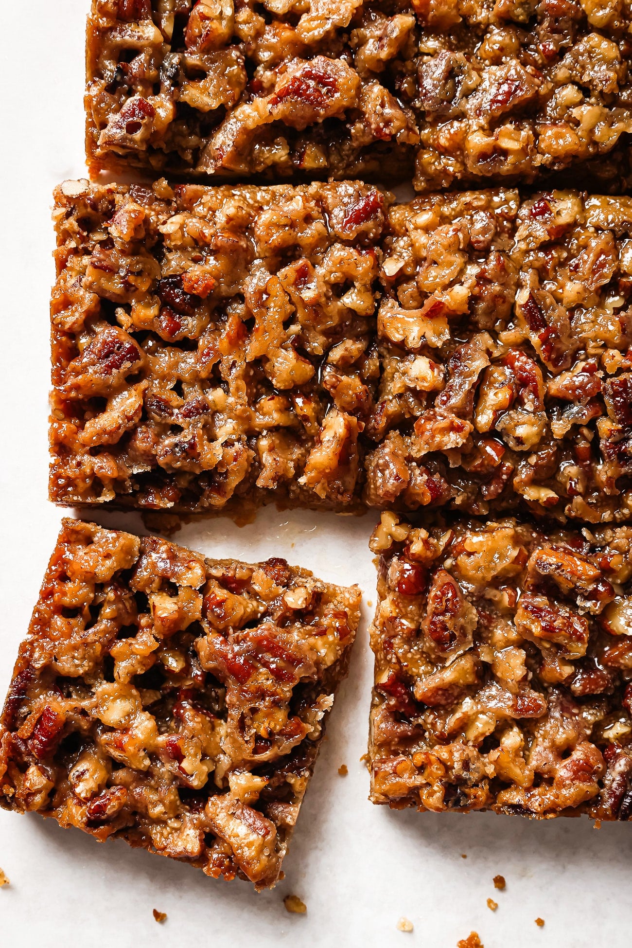 Close up of pecan pie bars on a countertop
