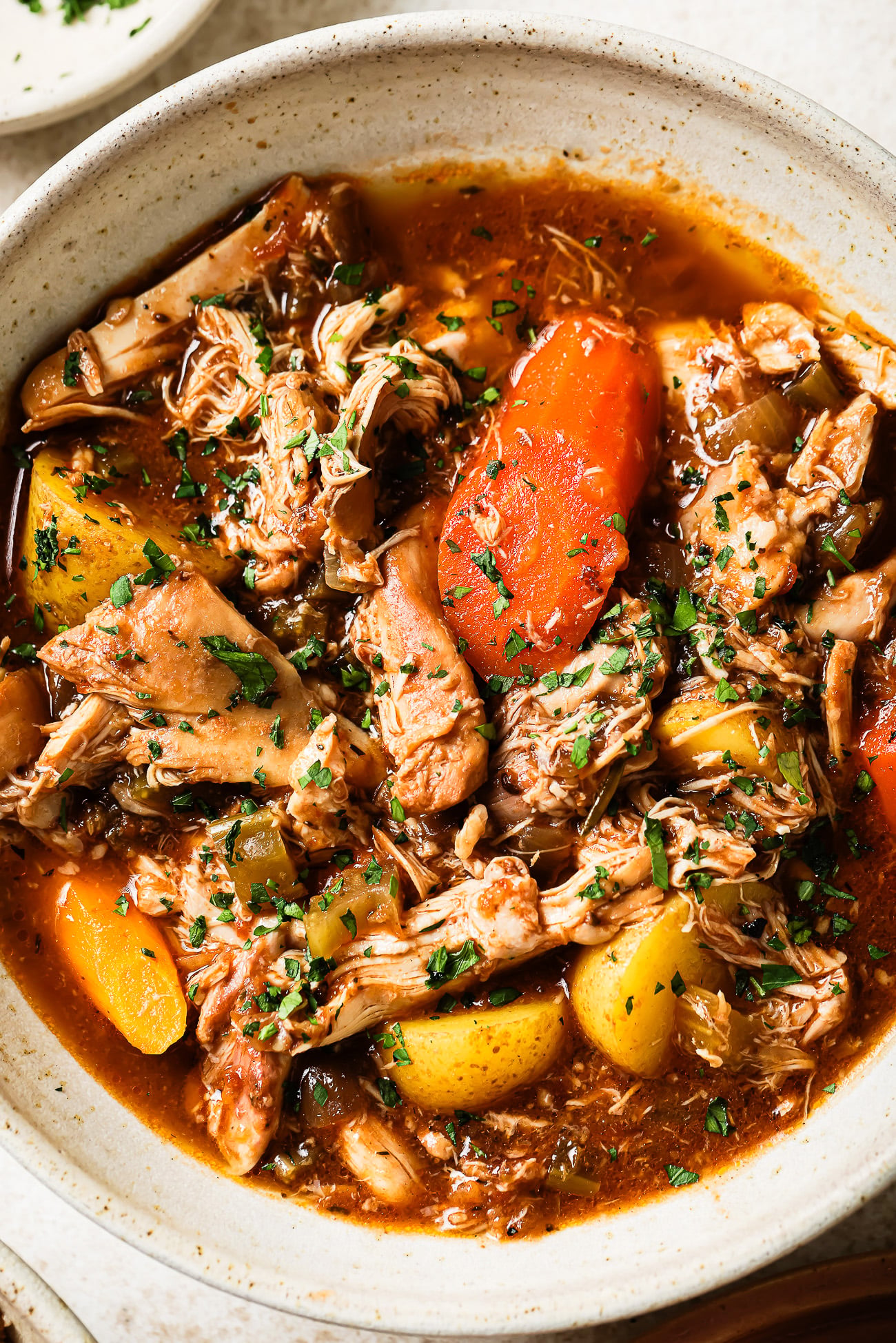 Overhead view of slow cooker chicken stew.