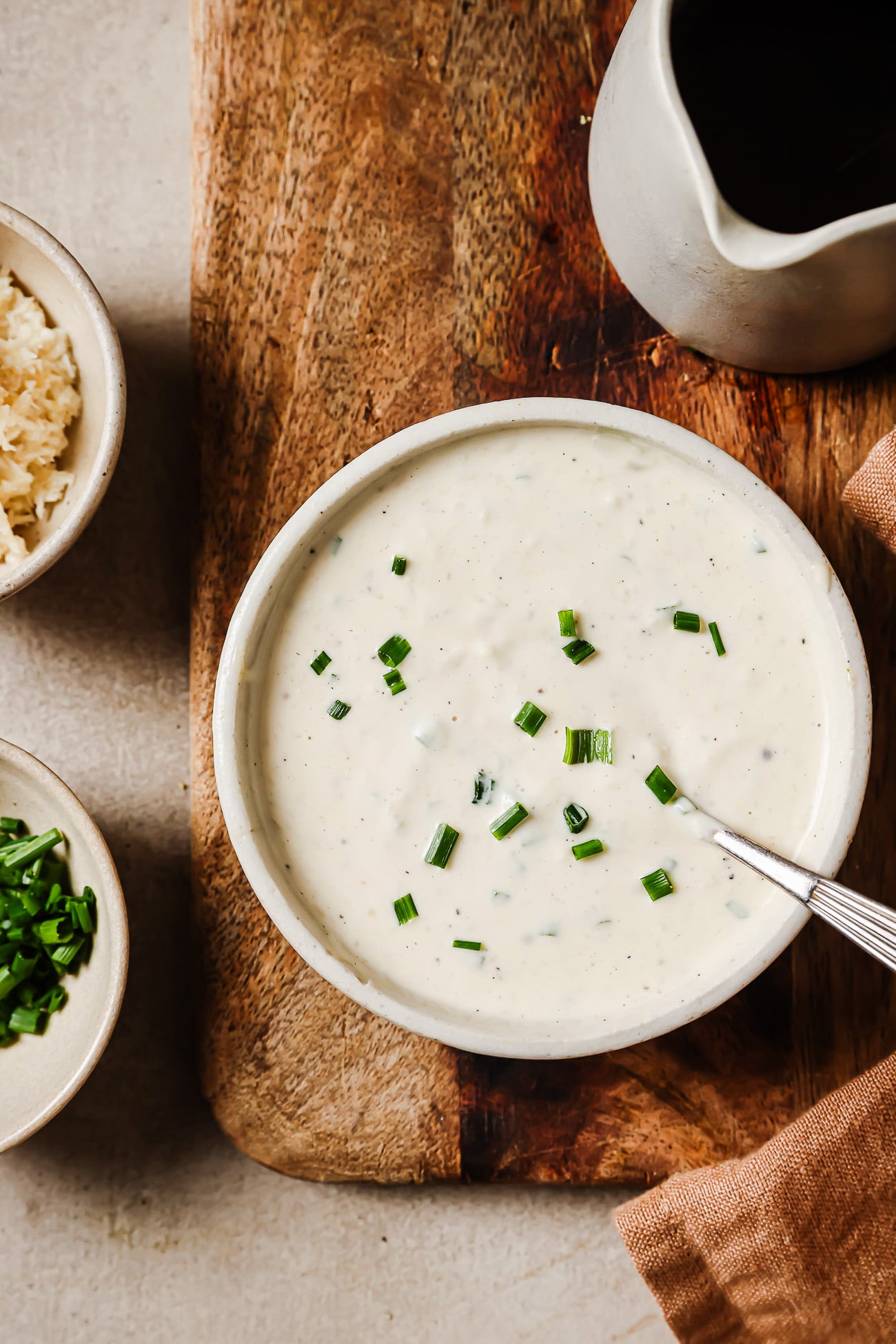 overhead view of horseradish sauce in a white bowl. 