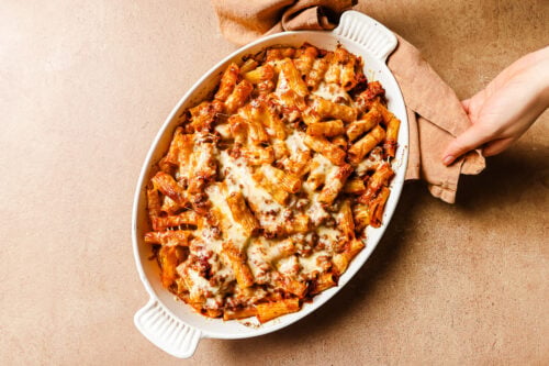 Just out of the oven: baked rigatoni with ground beef in a casserole dish.