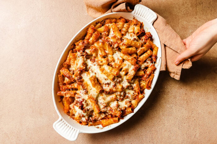 Just out of the oven: baked rigatoni with ground beef in a casserole dish.