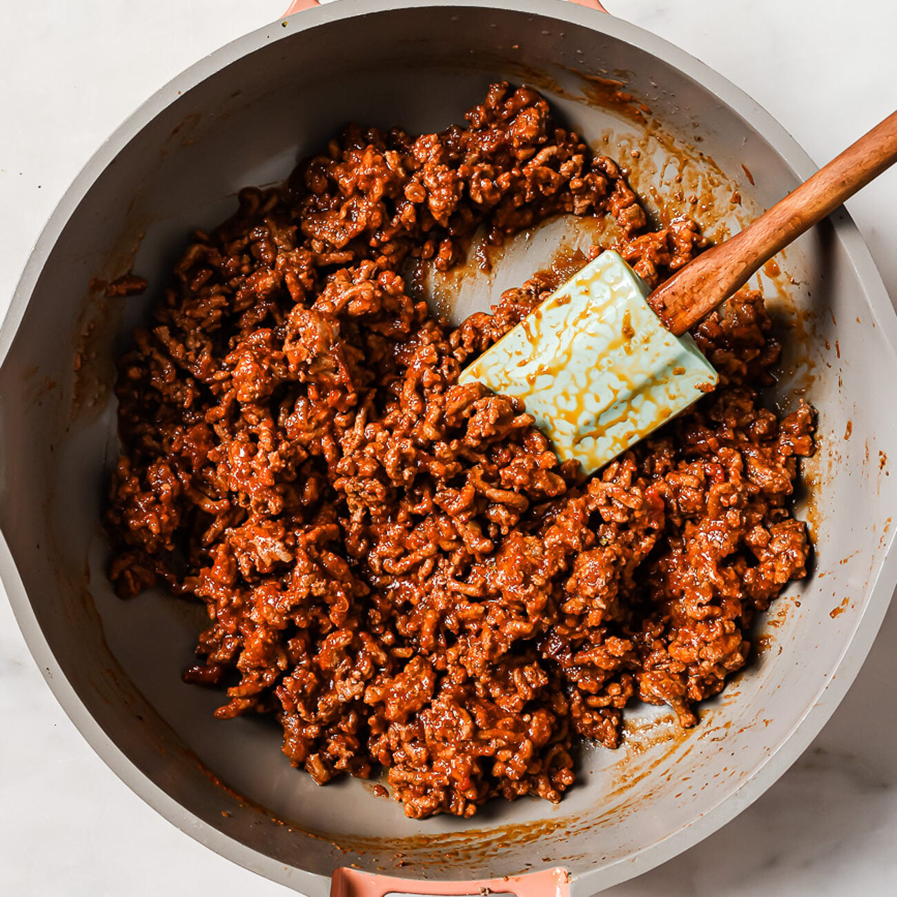 ground beef with tomato sauce in a skillet